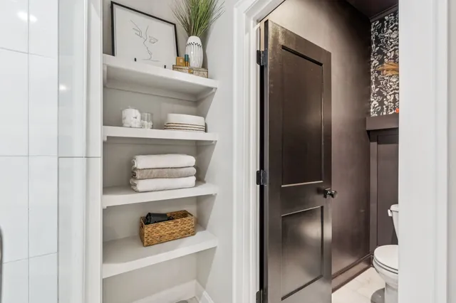 an aerial view of a house with a lake view