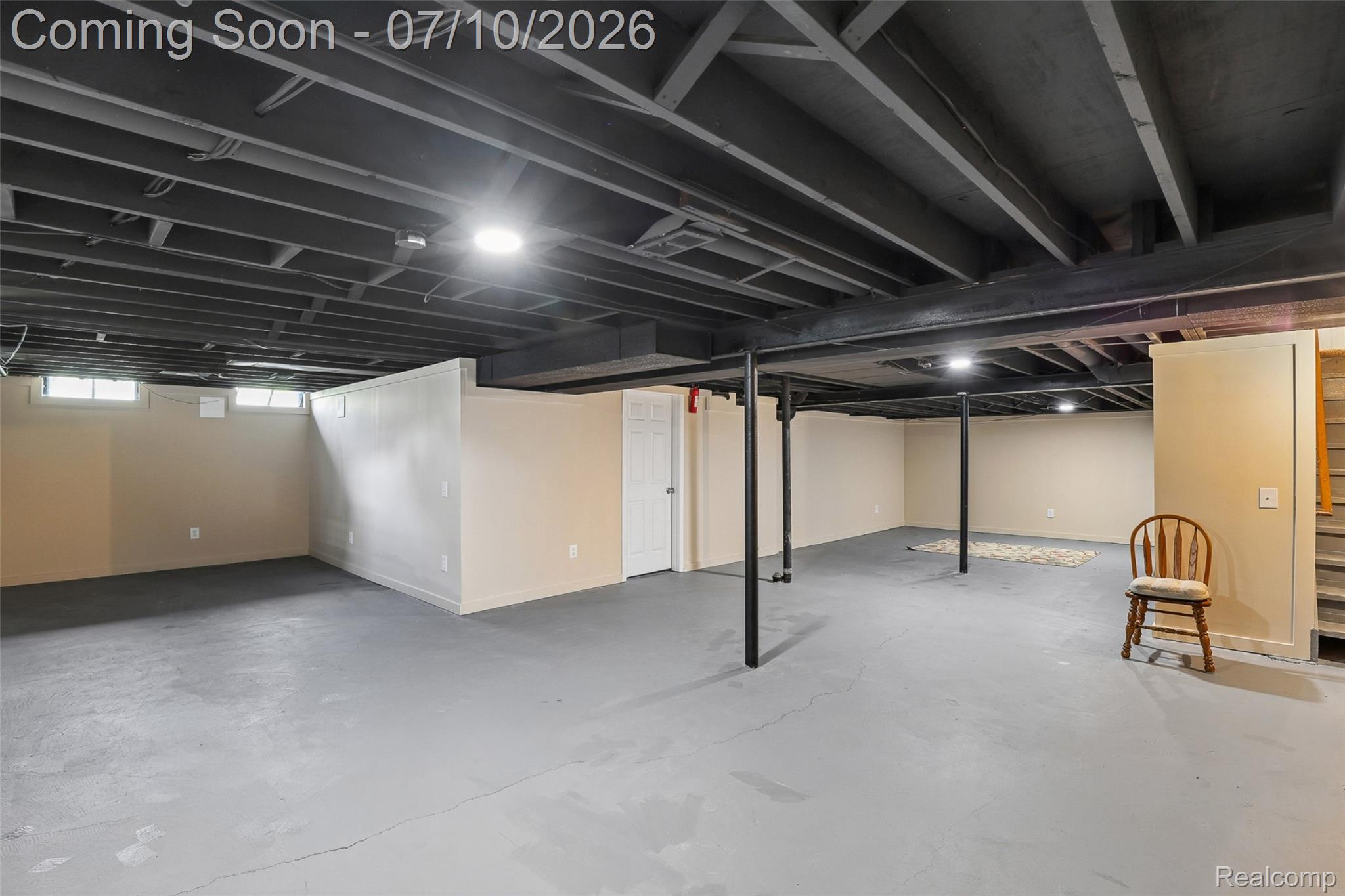 42698 Keystone Canton, MI 48187 - Photo 25 of 33 Expansive unfinished basement featuring painted concrete flooring, exposed ceiling joists, recessed lighting, and foundational support columns