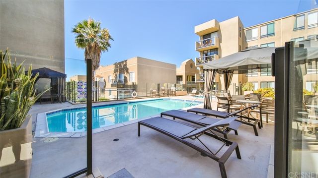 a bench sitting in front of a building