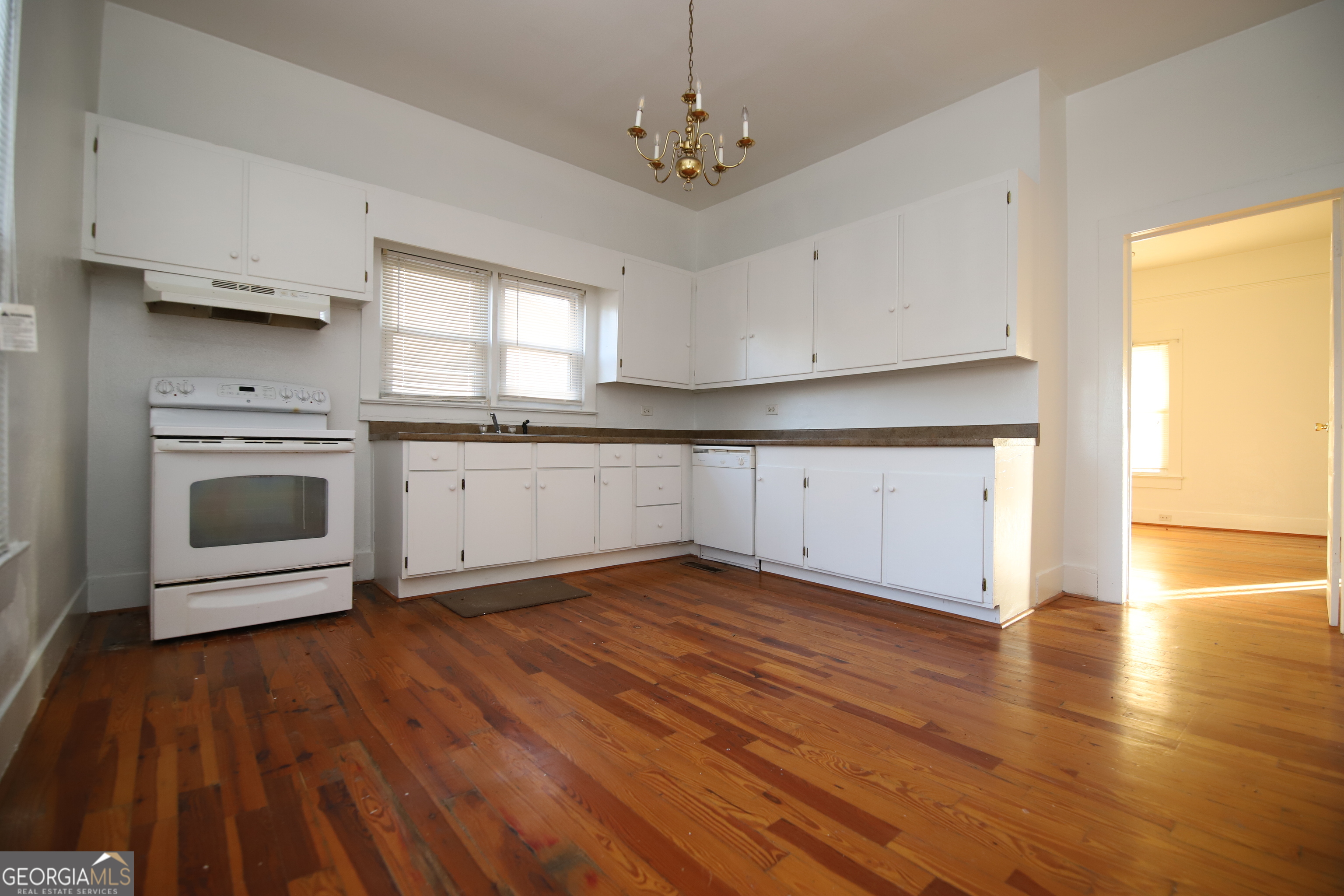 201 Jennings Street Valley, AL 36854 - Photo 13 of 24 a view of a kitchen with a sink wooden cabinets and stainless steel appliances