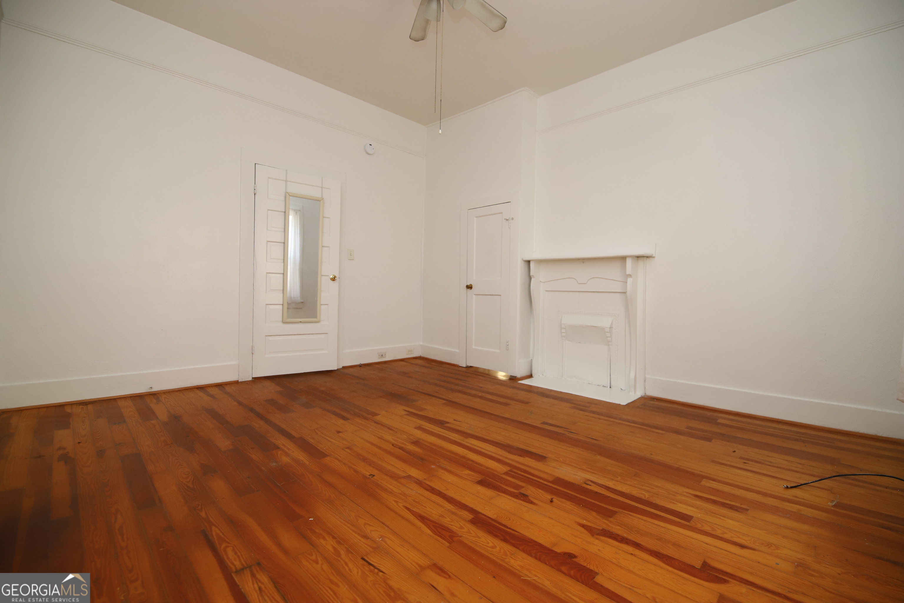 201 Jennings Street Valley, AL 36854 - Photo 16 of 24 a view of empty room with wooden floor and fan