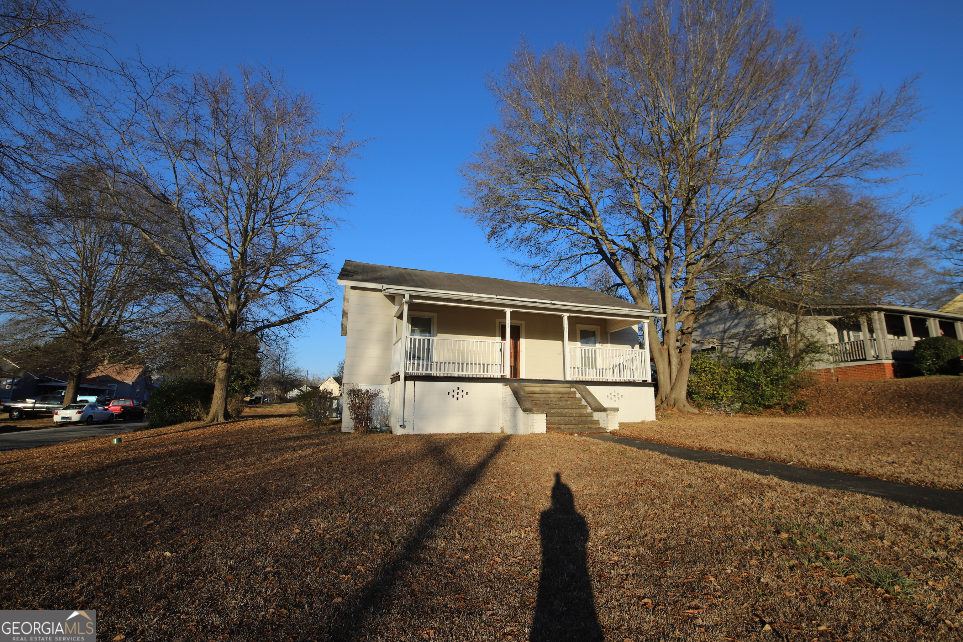 201 Jennings Street Valley, AL 36854 - Photo 2 of 24 a front view of a house with a yard and garage