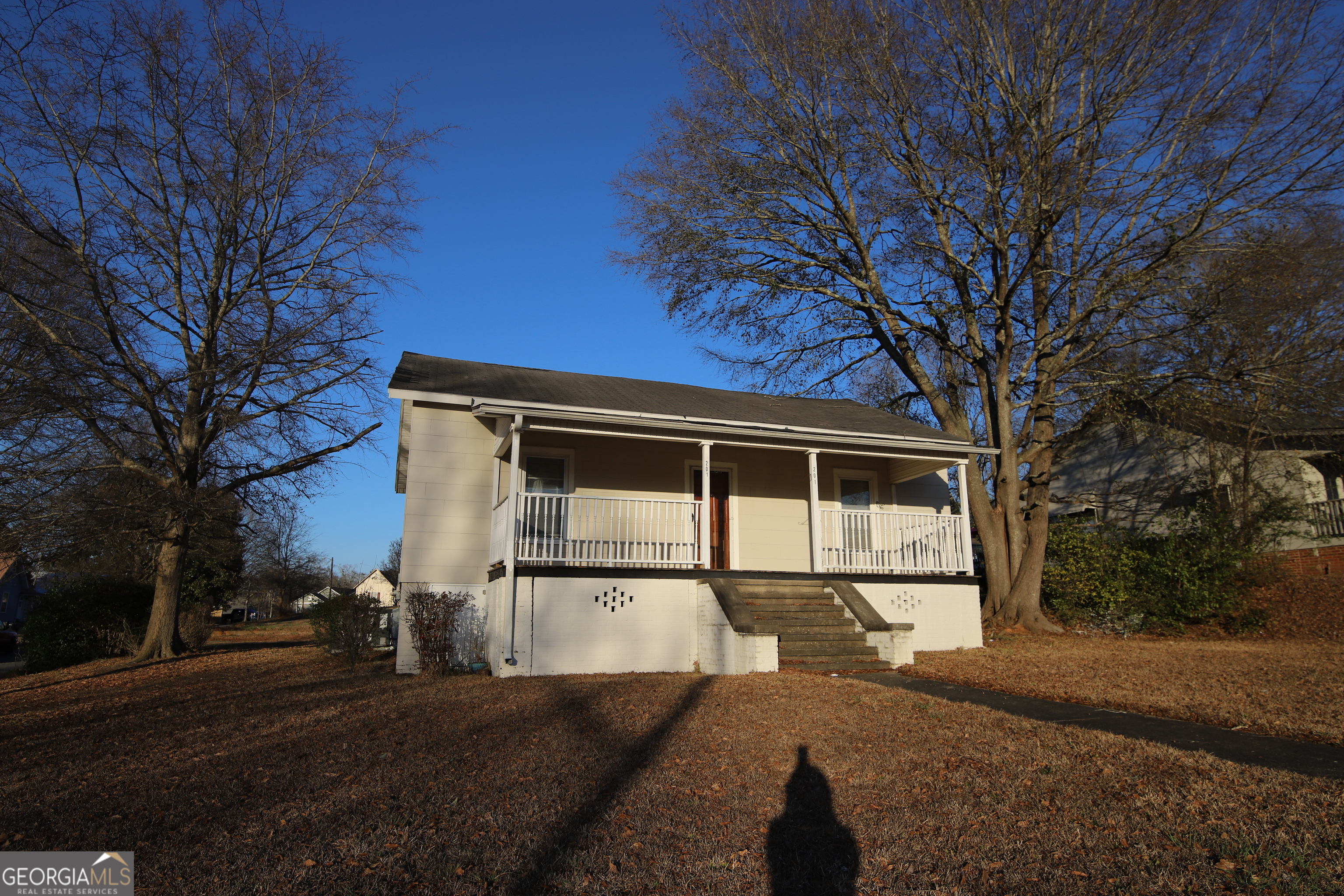 201 Jennings Street Valley, AL 36854 - Photo 3 of 24 a front view of a house with a yard and garage