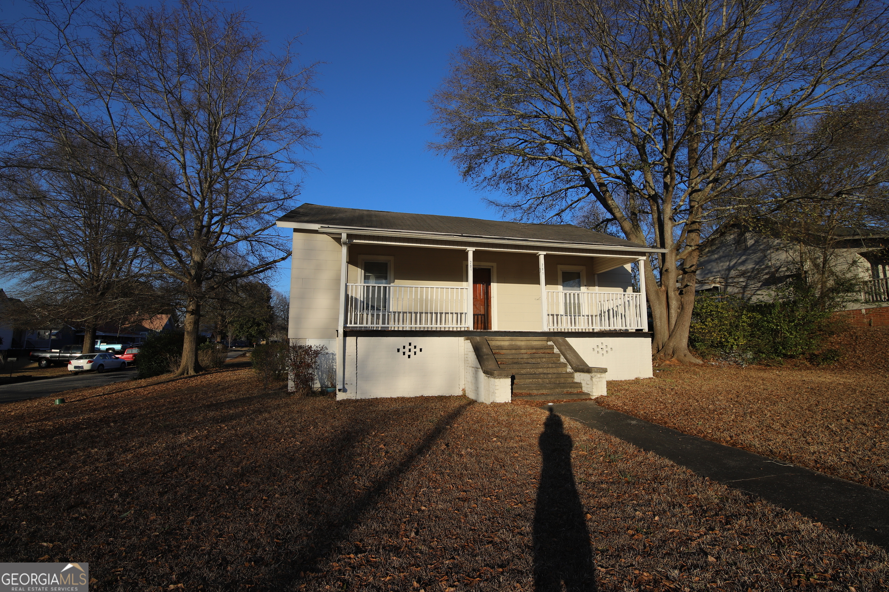 201 Jennings Street Valley, AL 36854 - Photo 5 of 24 a front view of a house with a yard and garage