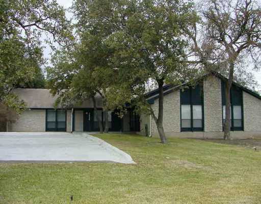 9006 Anderson Mill Road Austin, TX 78729 - Photo 1 of 1 a house that has a tree in front of it
