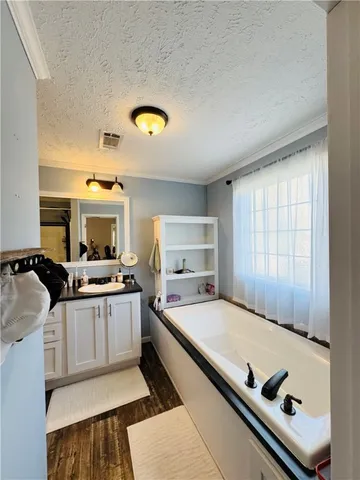 a room with a bed and furniture