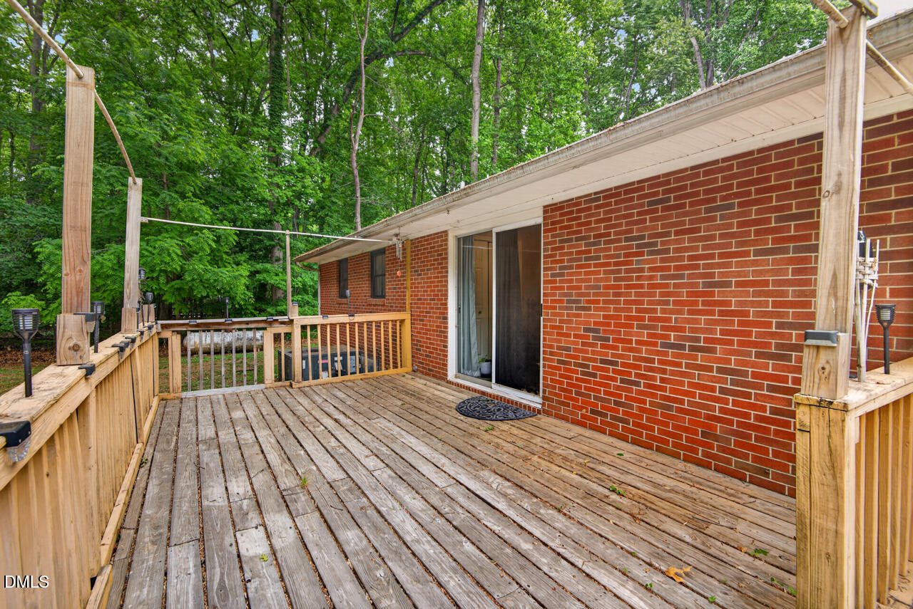 1420 Goodwin Road Durham, NC 27712 - Photo 16 of 54 a view of a wooden deck