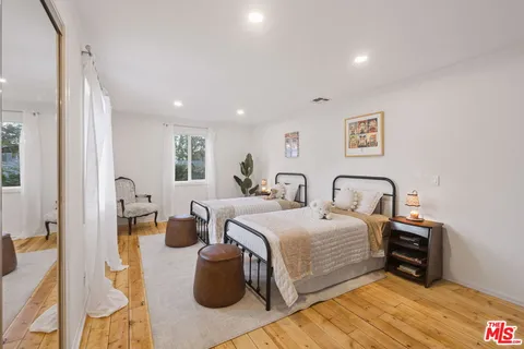 a bed room with a bed and a table