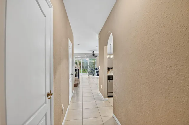 a view of a hallway with a dining area