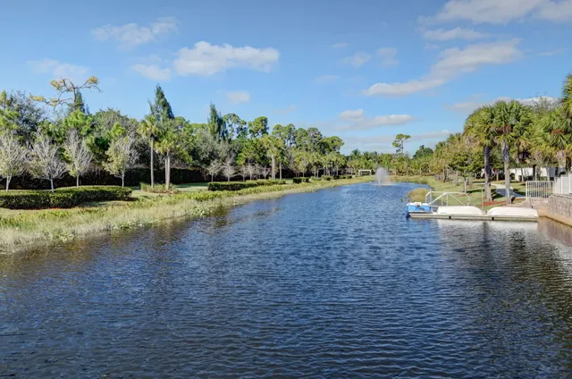 a view of a lake with houses in the back
