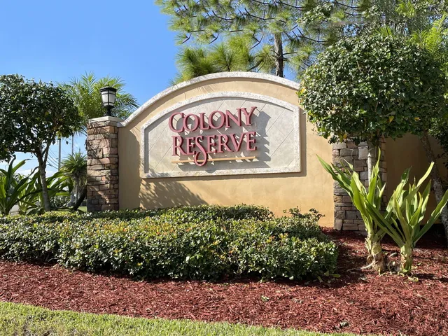 a sign that is on a brick wall