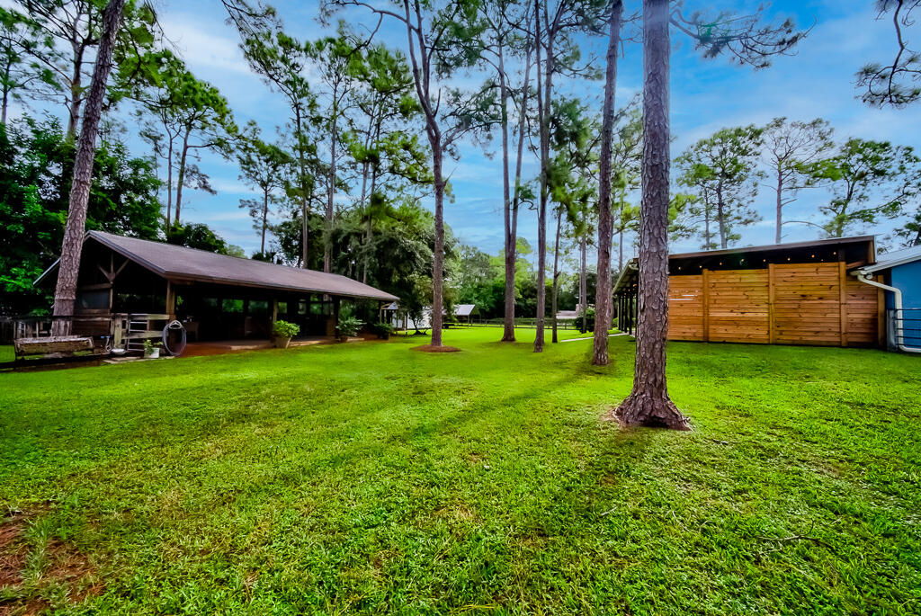 15733 Temple Boulevard Loxahatchee, FL 33470 - Photo 19 of 27 a view of a house with a park