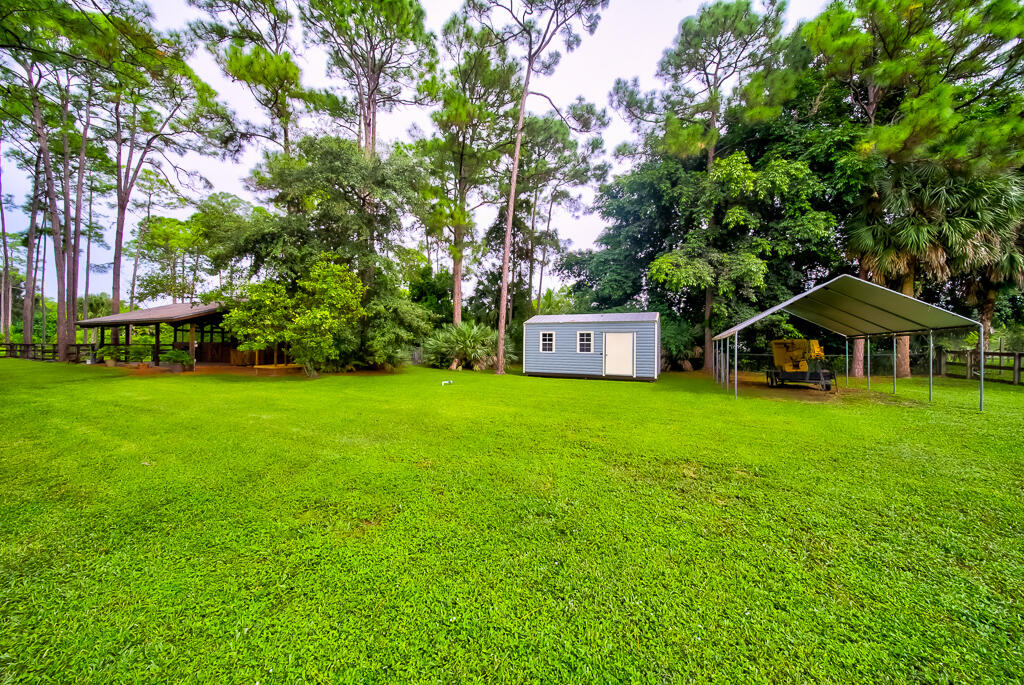 15733 Temple Boulevard Loxahatchee, FL 33470 - Photo 20 of 27 a view of a house with a yard