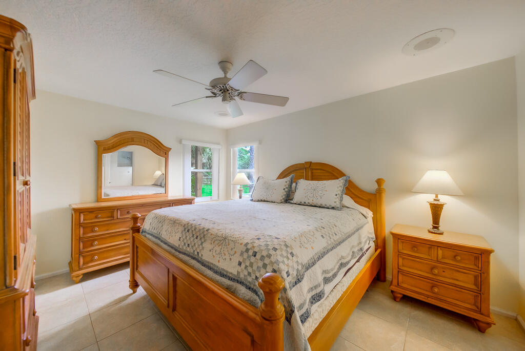 15733 Temple Boulevard Loxahatchee, FL 33470 - Photo 4 of 27 a bedroom with a bed and a dresser with window