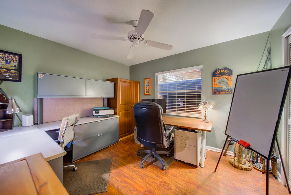 15733 Temple Boulevard Loxahatchee, FL 33470 - Photo 8 of 27 a view of a workspace with furniture and a window