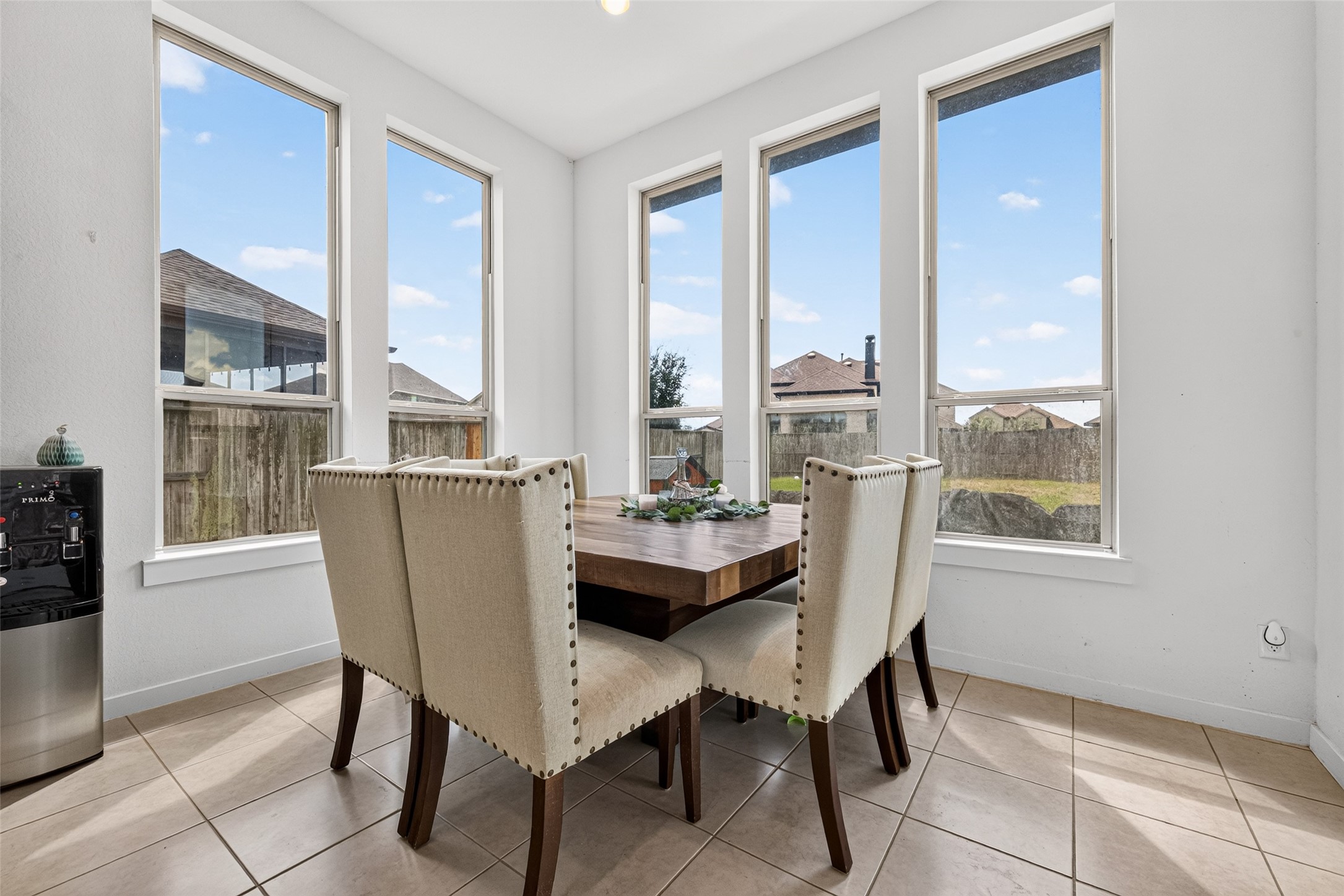 10114 Brush Way Rosharon, TX 77583 - Photo 20 of 50 Bright breakfast area with large windows offering abundant natural light and a view of the backyard.