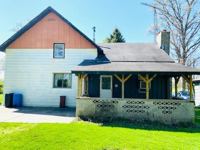17731 East 2880 N Road Alvin, IL 61811 - Photo 1 of 17 a front view of brick house with a yard