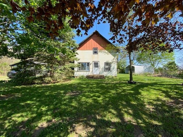 17731 East 2880 N Road Alvin, IL 61811 - Photo 17 of 17 a front view of a house with a yard and trees