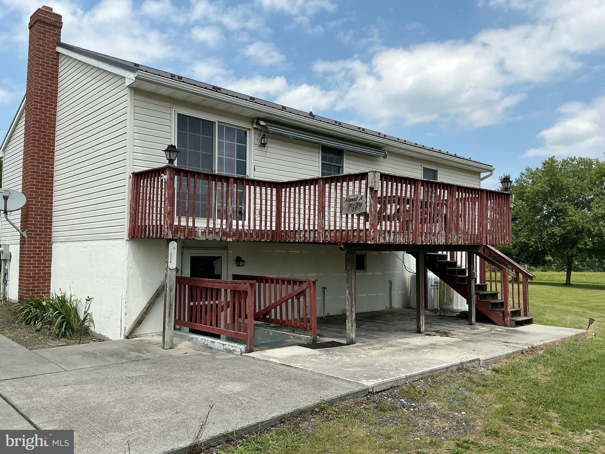 665 Game Lands Road Aspers, PA 17304 - Photo 4 of 40 a view of a house with wooden deck and a backyard