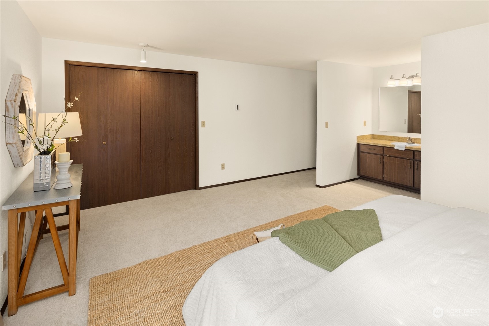 4100 Lake Washington Boulevard North, Unit A202 Renton, WA 98056 - Photo 14 of 25 a bedroom with a bed and a cabinets