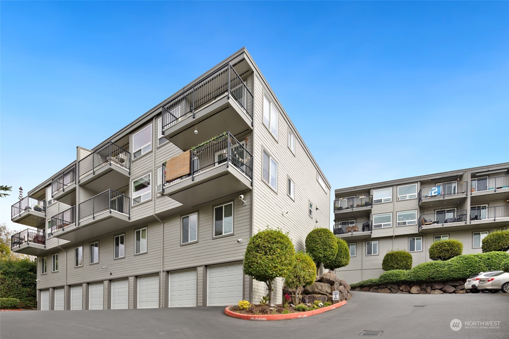 4100 Lake Washington Boulevard North, Unit A202 Renton, WA 98056 - Photo 22 of 25 a front view of a house with a yard