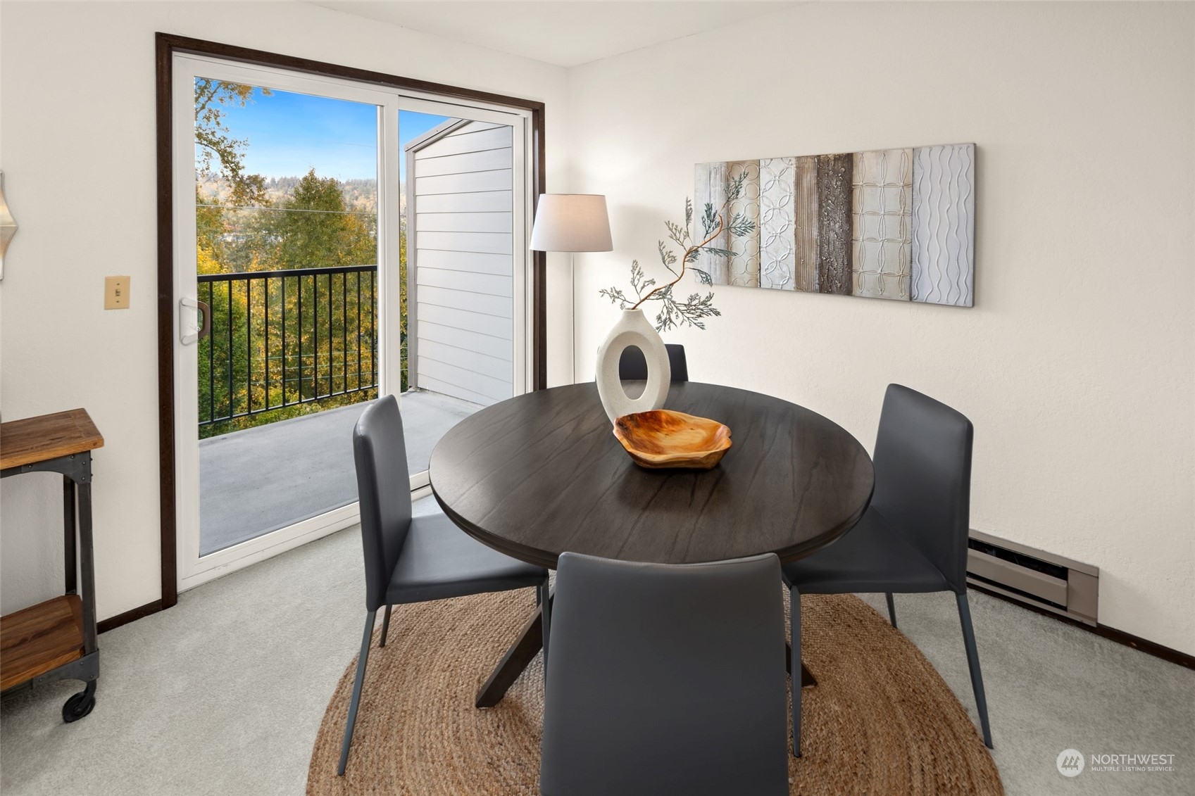 4100 Lake Washington Boulevard North, Unit A202 Renton, WA 98056 - Photo 6 of 25 a view of a dining room with furniture window and wooden floor