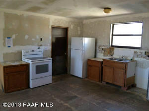 745 West Antelope Run Road Paulden, AZ 86334 - Photo 3 of 24 a kitchen with a stove and a refrigerator
