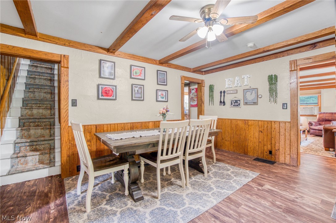15221 Thompson Road Thompson, OH 44086 - Photo 14 of 31 Dining space featuring beamed ceiling, ceiling fan, and hardwood / wood-style flooring