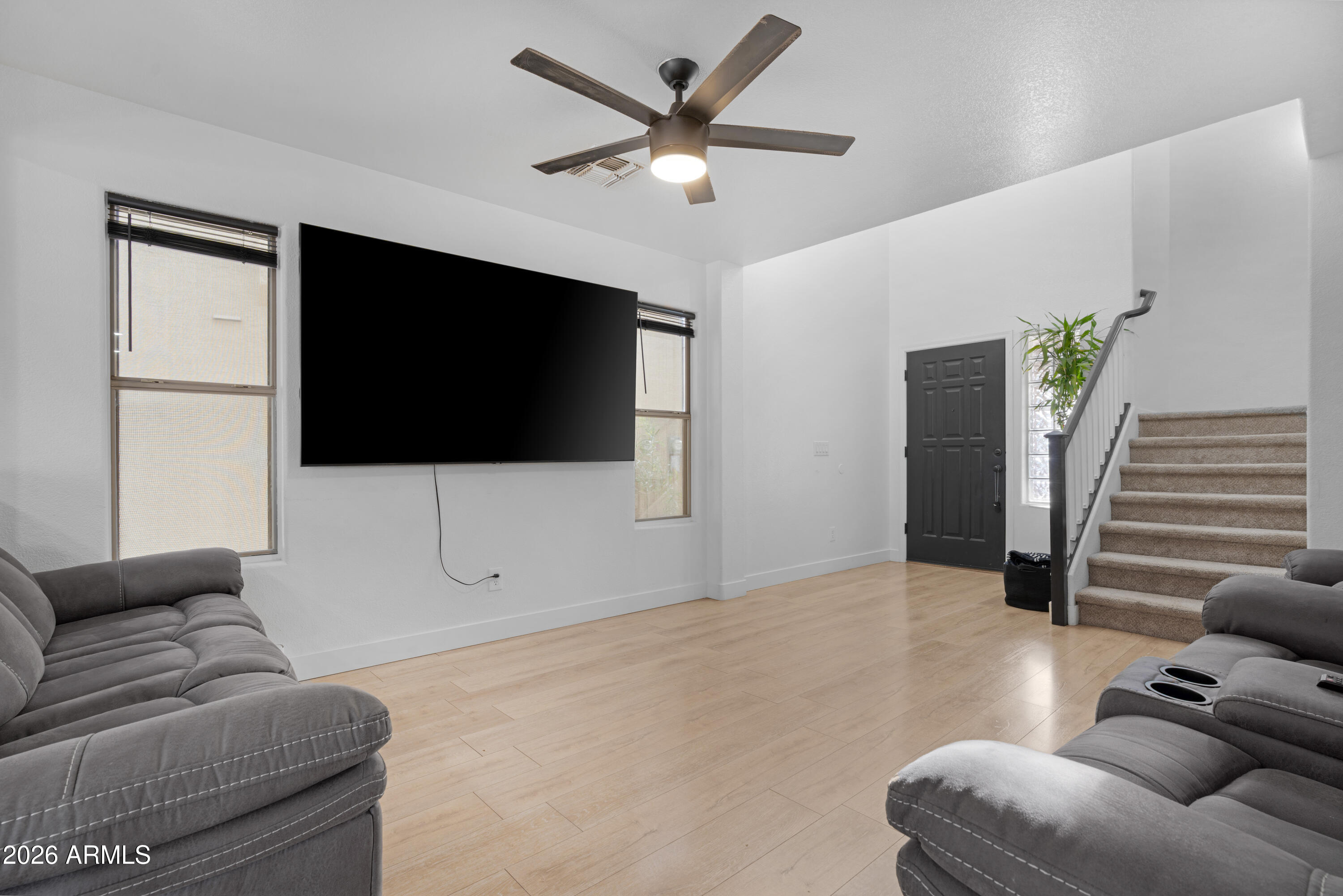 1810 East Milky Way Gilbert, AZ 85295 - Photo 8 of 46 a living room with furniture and a flat screen tv
