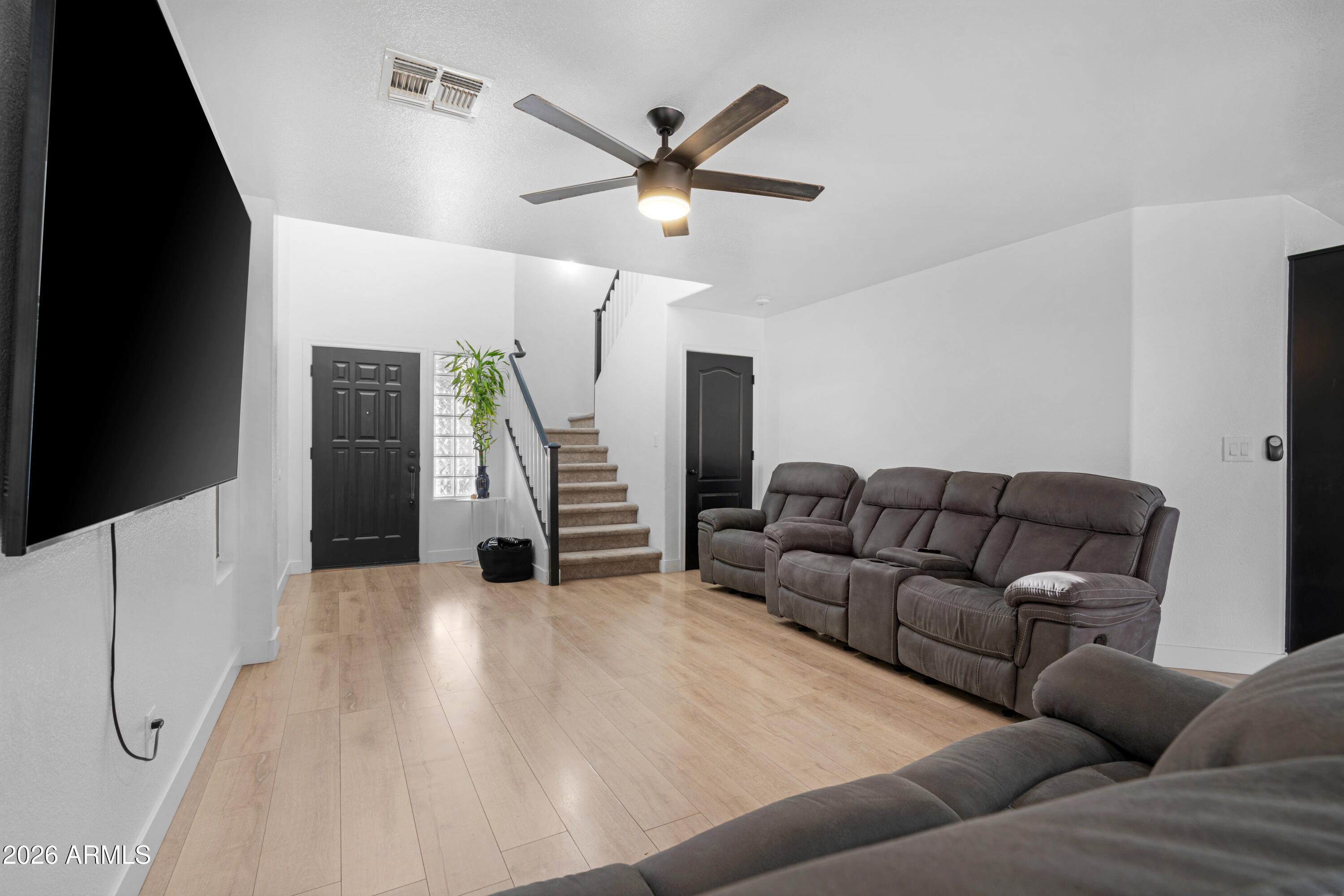 1810 East Milky Way Gilbert, AZ 85295 - Photo 9 of 46 a living room with furniture and a ceiling fan