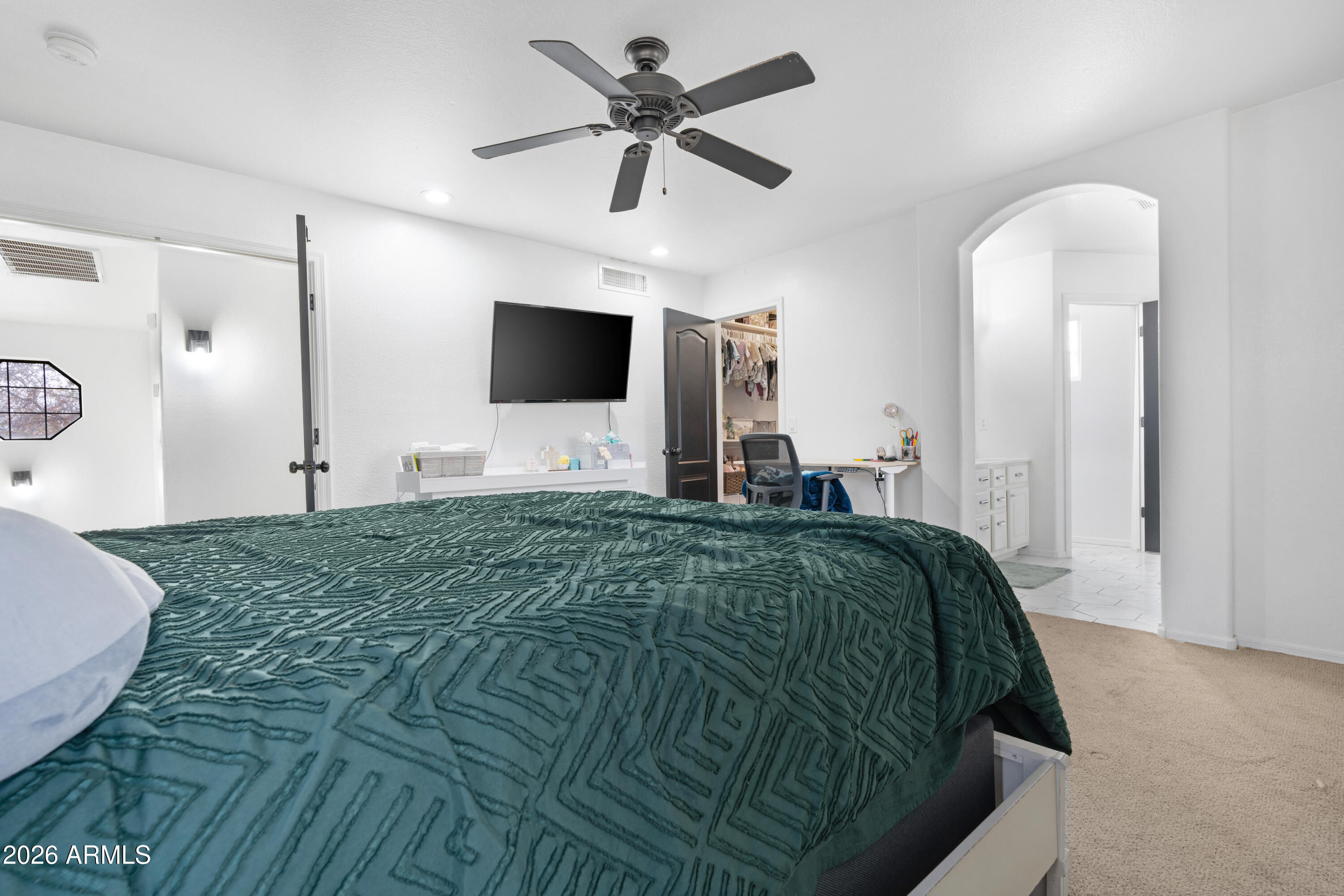 1810 East Milky Way Gilbert, AZ 85295 - Photo 21 of 46 a bedroom with a bed and a flat screen tv