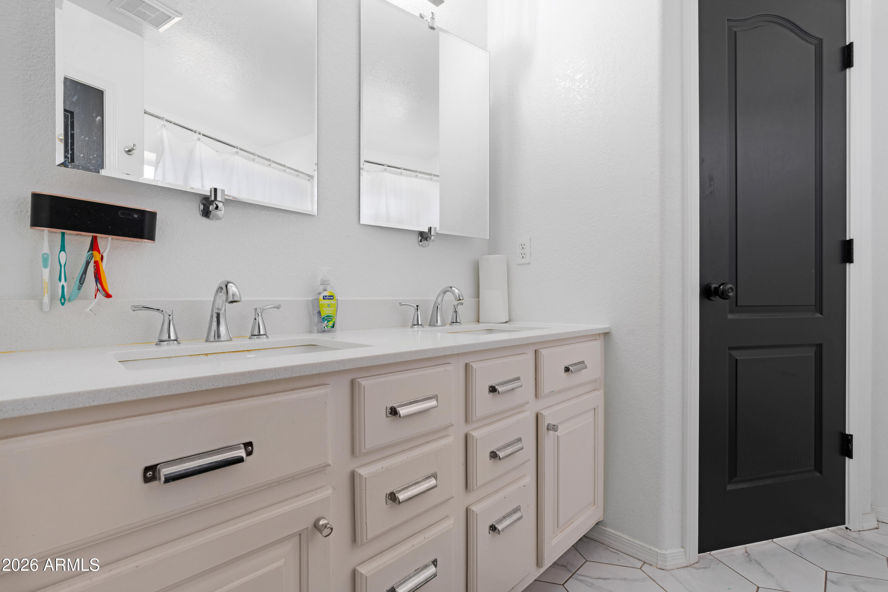 1810 East Milky Way Gilbert, AZ 85295 - Photo 23 of 46 a bathroom with a sink a mirror and vanity