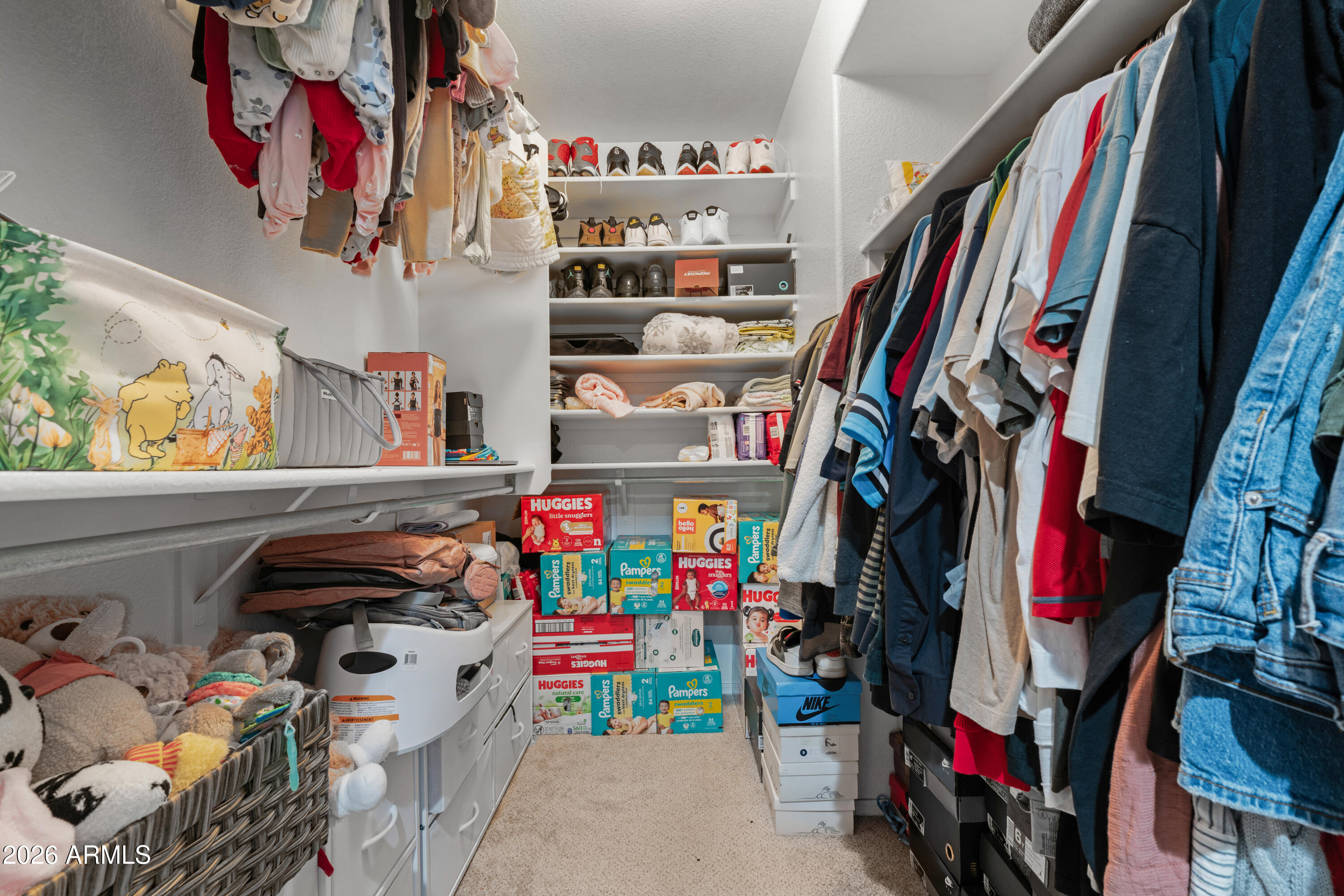 1810 East Milky Way Gilbert, AZ 85295 - Photo 25 of 46 a view of walk in closet with clothes and shoes