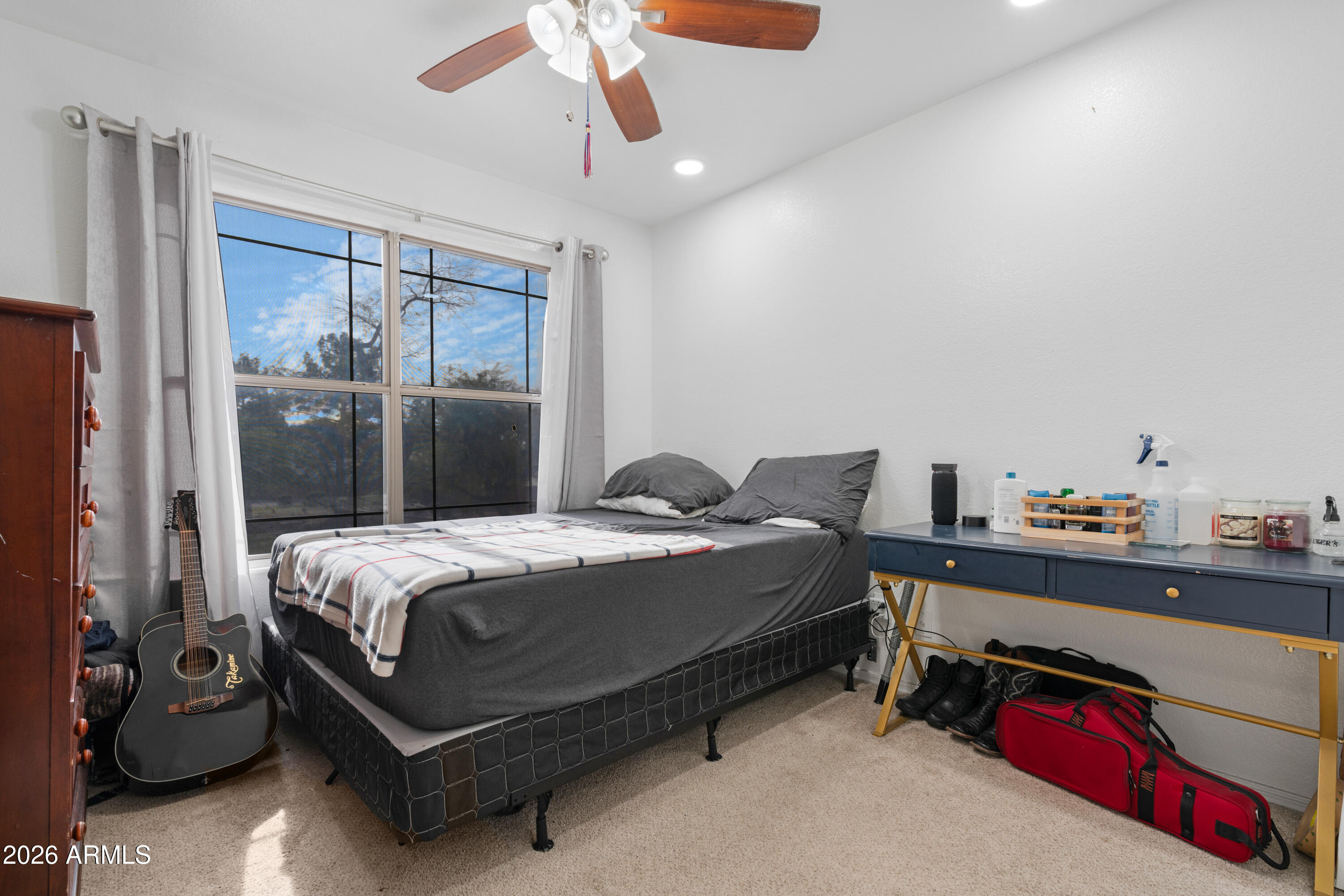 1810 East Milky Way Gilbert, AZ 85295 - Photo 26 of 46 a bed sitting in a bedroom next to a window
