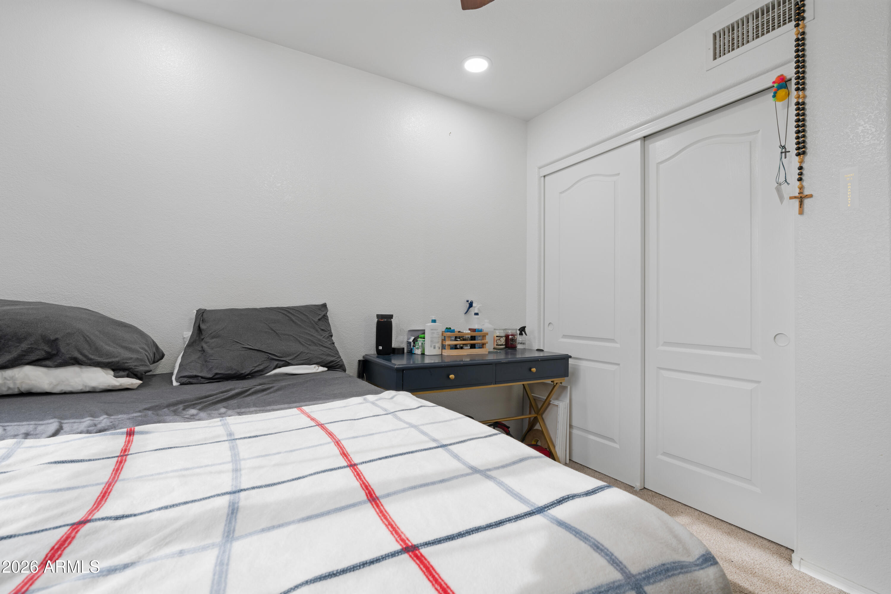 1810 East Milky Way Gilbert, AZ 85295 - Photo 27 of 46 a bedroom with two beds and a closet