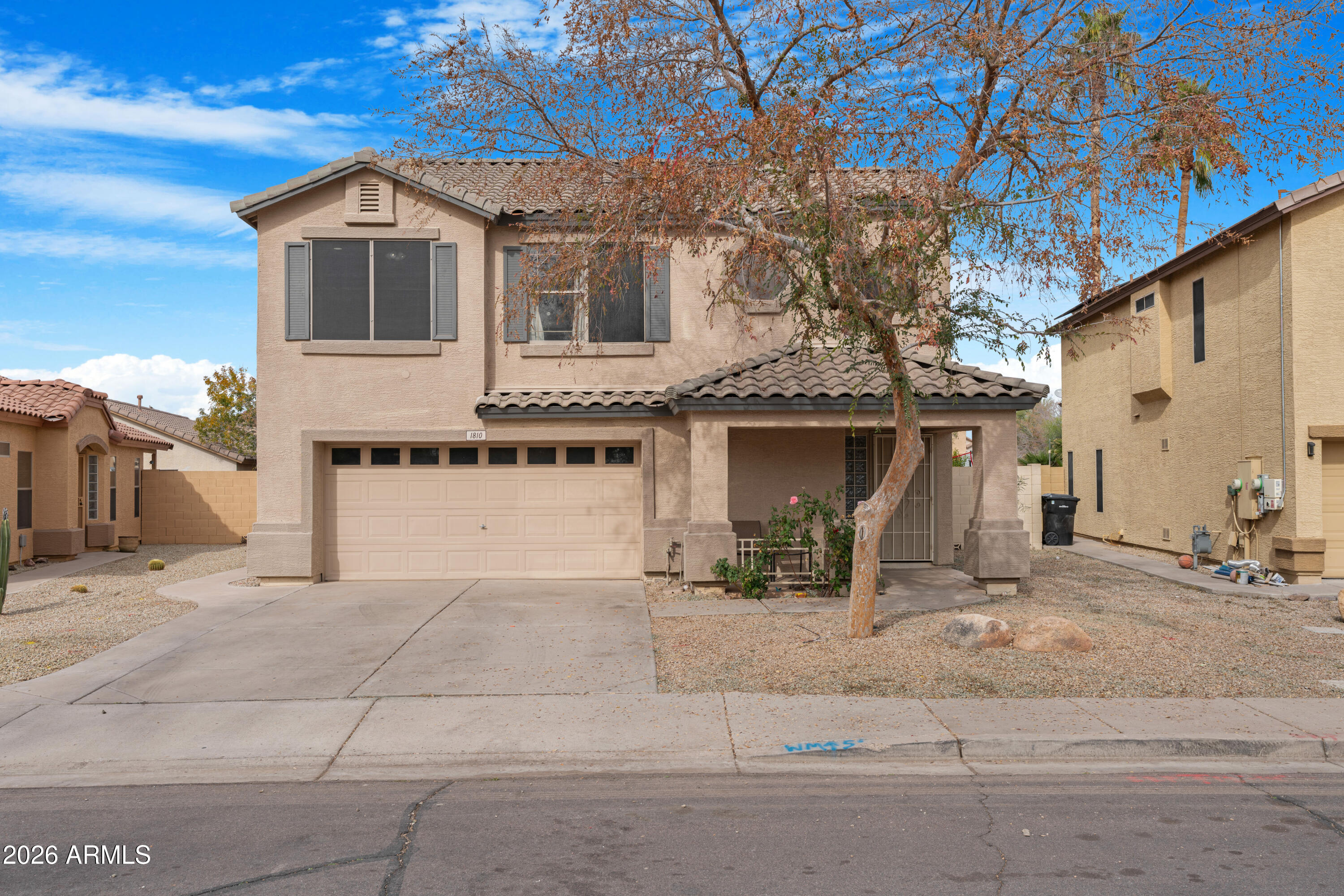 1810 East Milky Way Gilbert, AZ 85295 - Photo 2 of 46 a front view of a house with yard