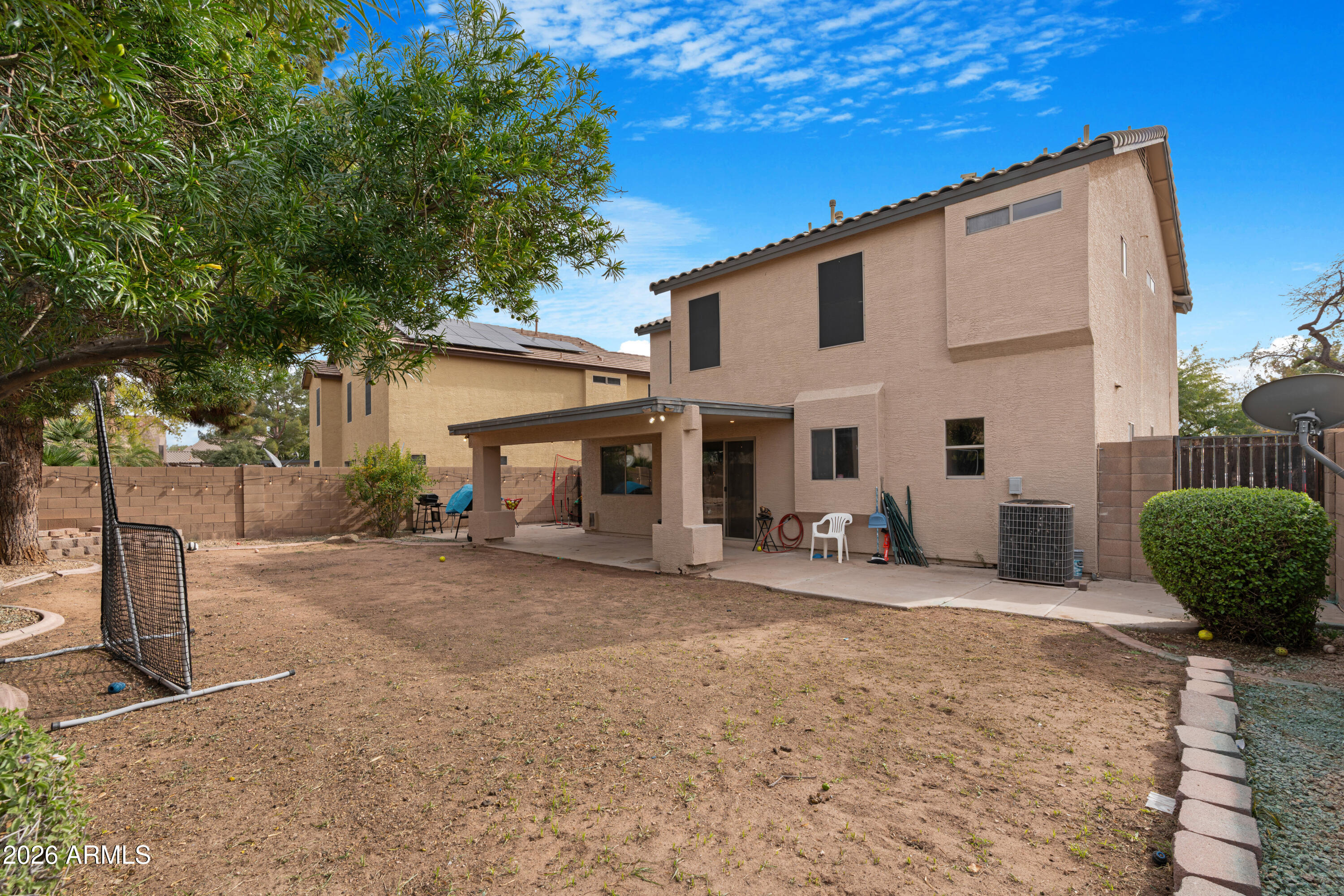 1810 East Milky Way Gilbert, AZ 85295 - Photo 33 of 46 a view of a house with backyard and a tree