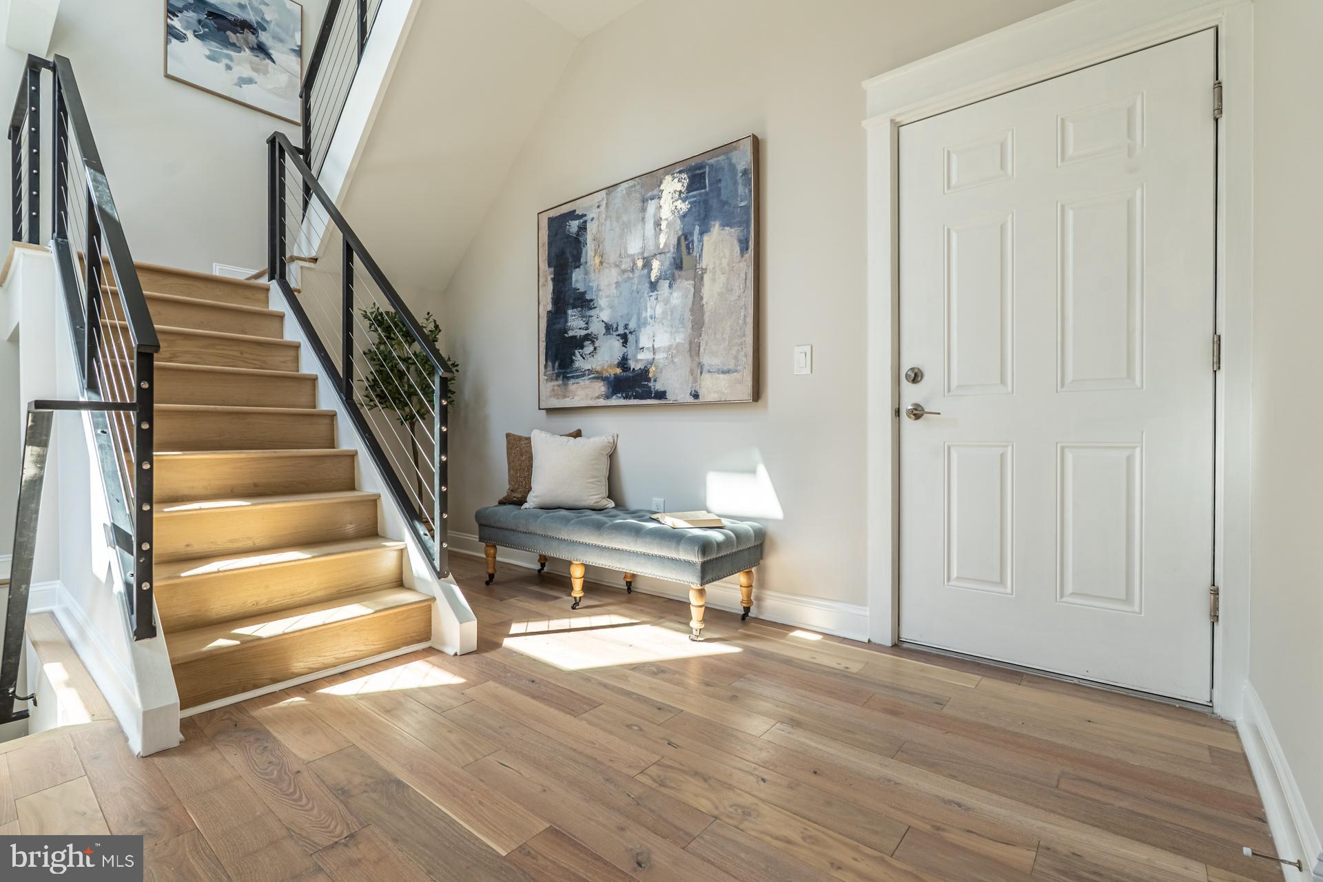 1636 South 2nd Street Philadelphia, PA 19148 - Photo 3 of 39 a view of a hallway with wooden floor and workspace
