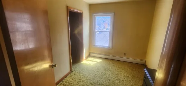 a view of bathroom with a sink and glass door