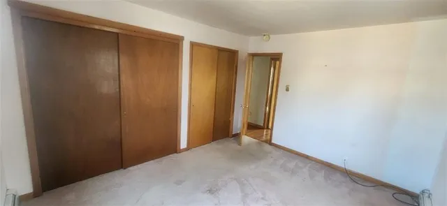 a room with a rug and a window