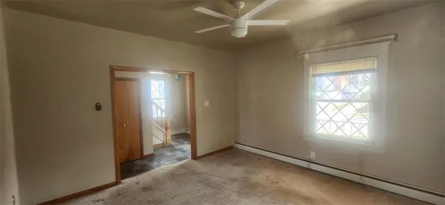 a view of an empty room and window