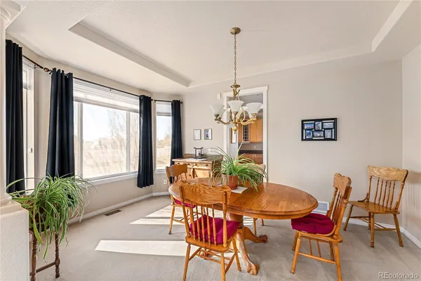 a view of a dining room with furniture window and outside view