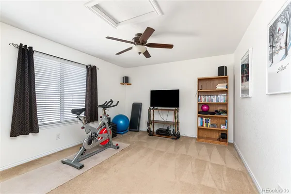 a view of a livingroom with furniture and a flat screen tv