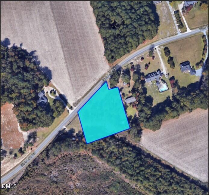 4266 Sids Mill Road Fayetteville, NC 28312 - Photo 3 of 6 a view of a yard with a wooden fence