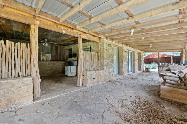 a view of a chairs and table in the patio