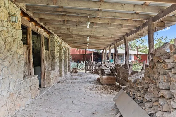a kitchen with a table chairs stove and cabinets