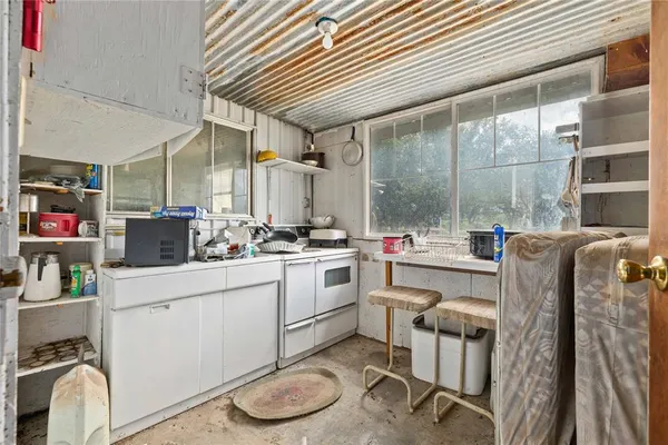 a view of livingroom with furniture and a window