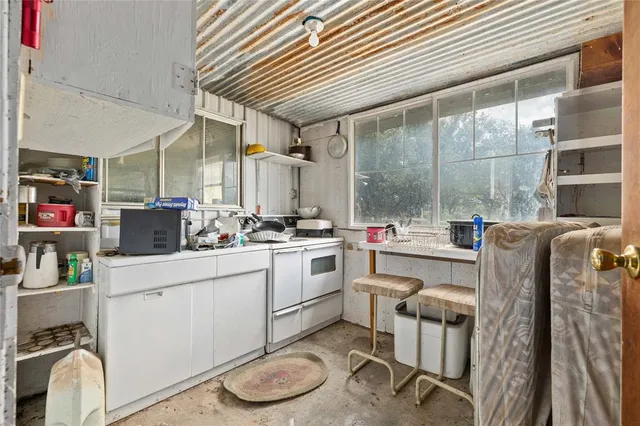 a view of livingroom with furniture and a window