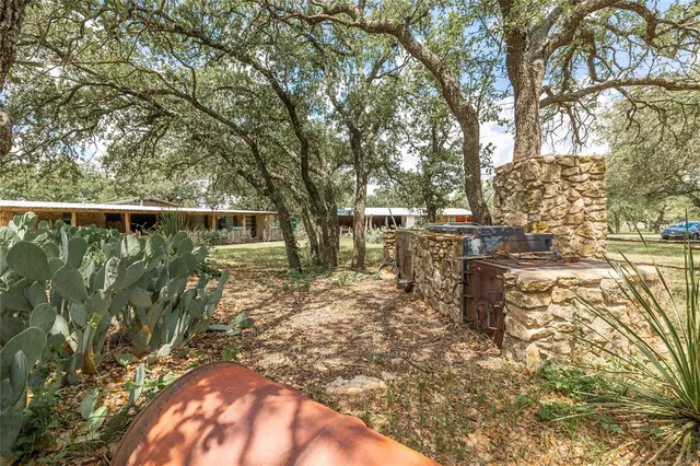 a backyard of a house with garden and patio