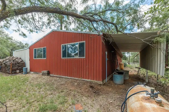 a view of a lake with beach and wooden floor